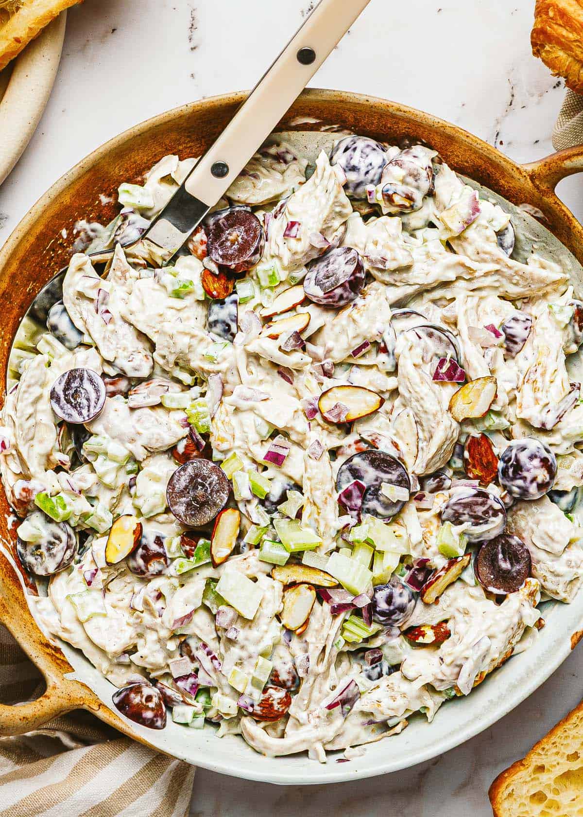 Close up shot of a bowl of homemade chicken salad. 