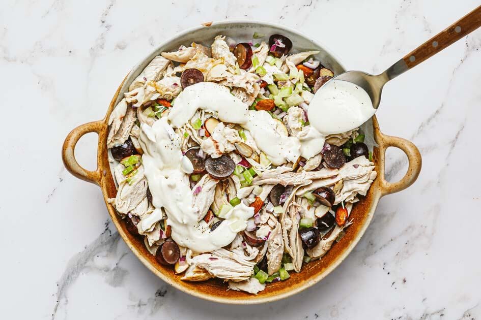 Chicken salad with a creamy dressing drizzled over it. 