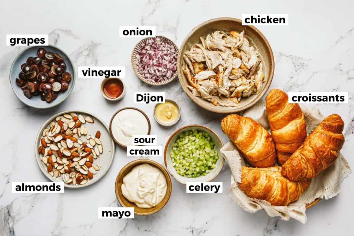Bowls of ingredients to make a simple chicken salad recipe. 