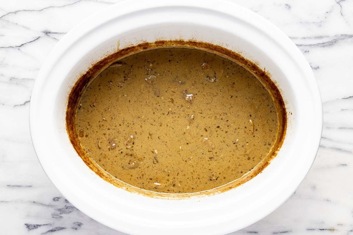 Slow cooked beef in a creamy mushroom sauce in a crockpot. 