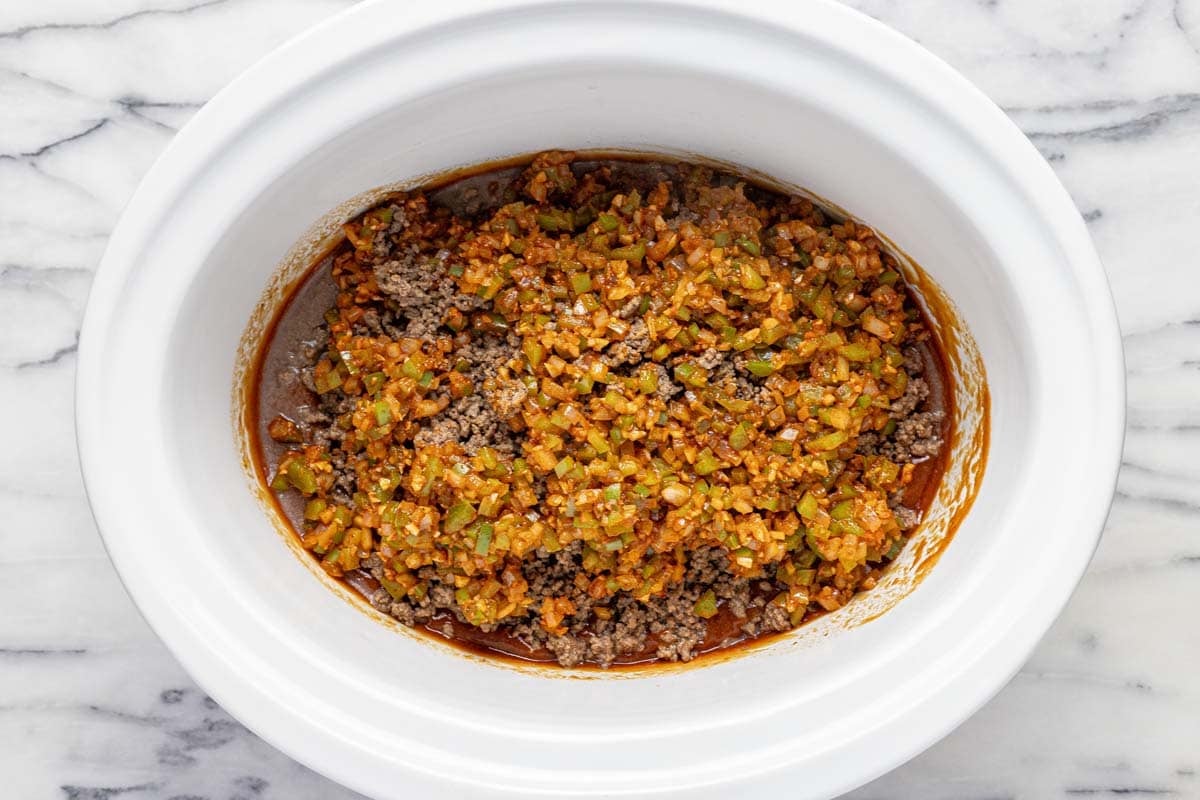 Sauteed veggies, ground beef, and sloppy joe sauce in a crock pot. 