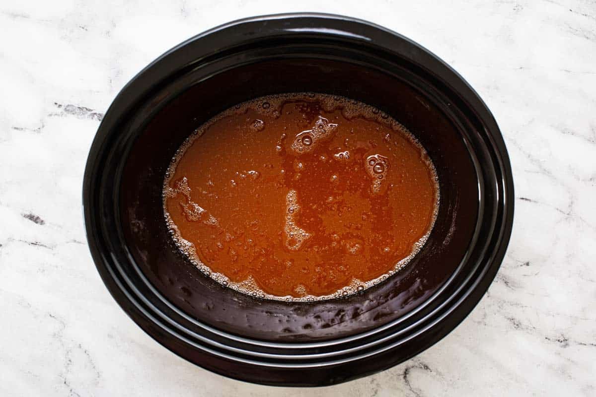 Sweet and sour meatball sauce in a slow cooker. 