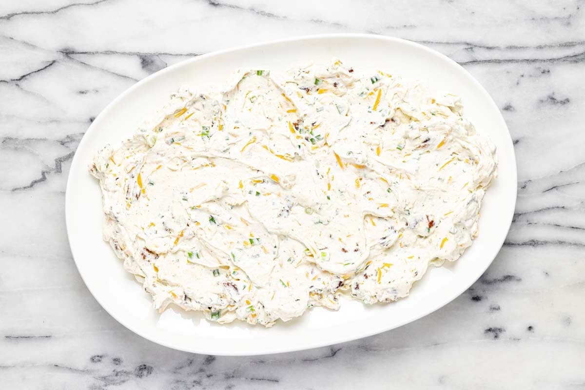 Creamy BLT dip spread on a large serving platter. 
