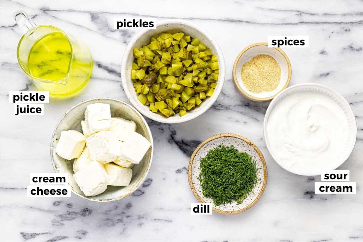 Bowls of ingredients to make dill pickle dip. 