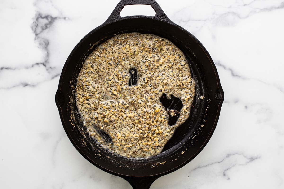 Butter, garlic, herbs, and flour in a cast iron pan. 