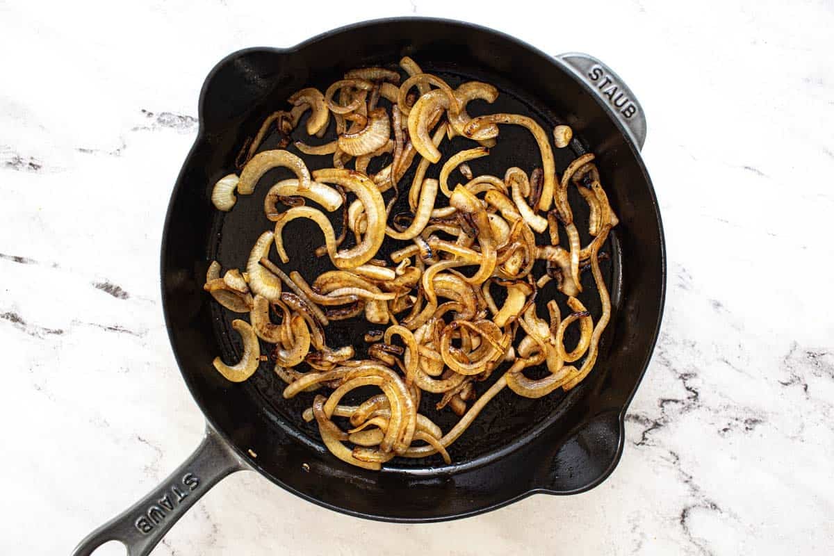 Caramelized onions in a cast iron pan.