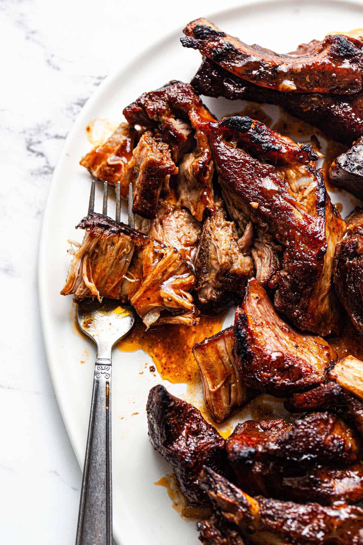 Close up of a plate of country style barbecue ribs. 