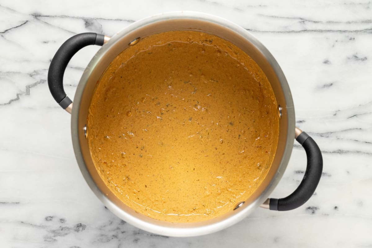 Large pot filled with creamy chili cheese dip. 