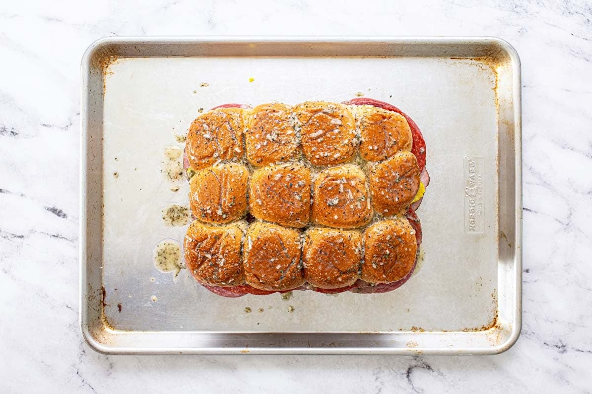 Italian sliders assembled and brushed with a Parmesan herb butter sauce. 