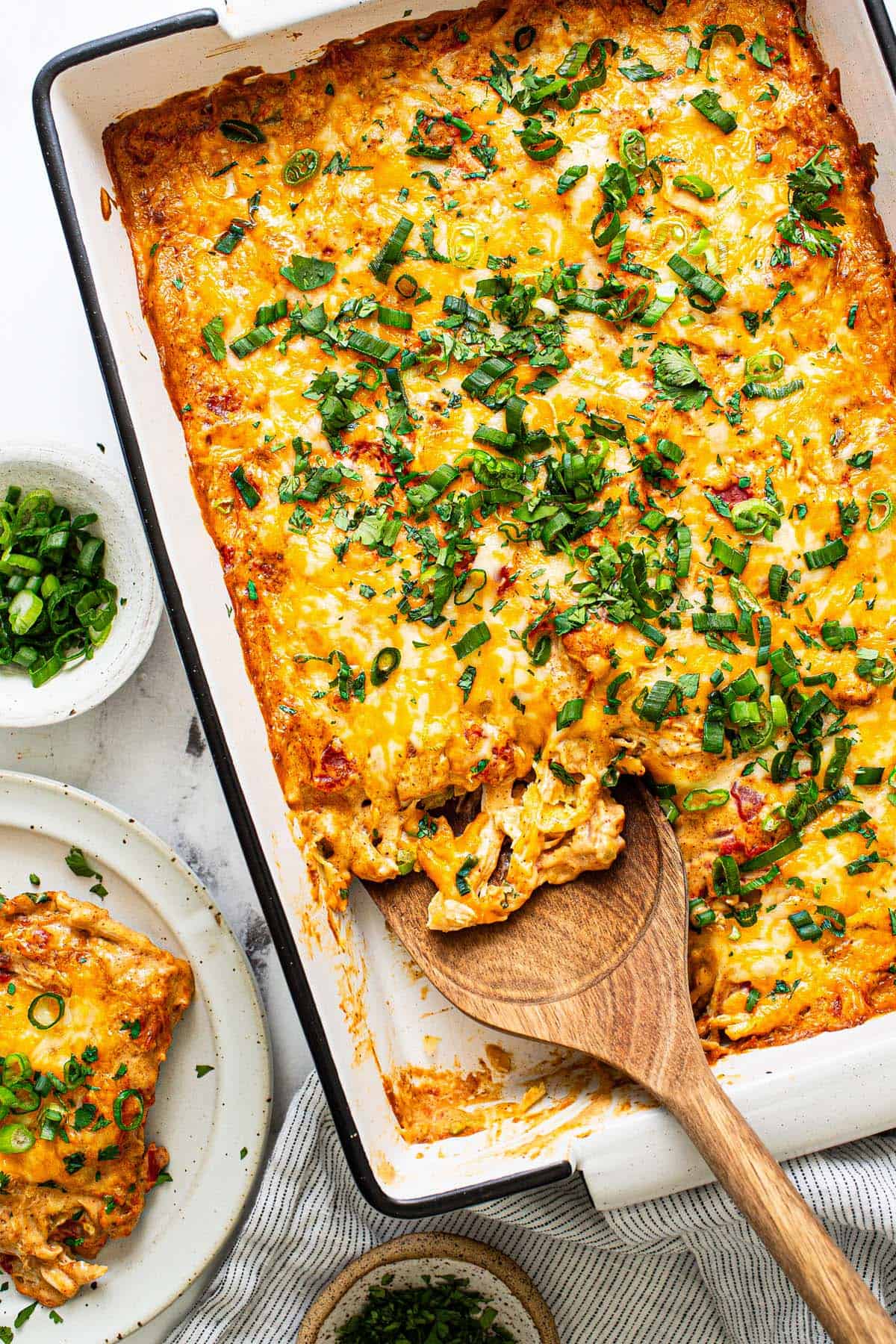 Freshly baked king ranch chicken casserole garnished with green onion and cilantro. 