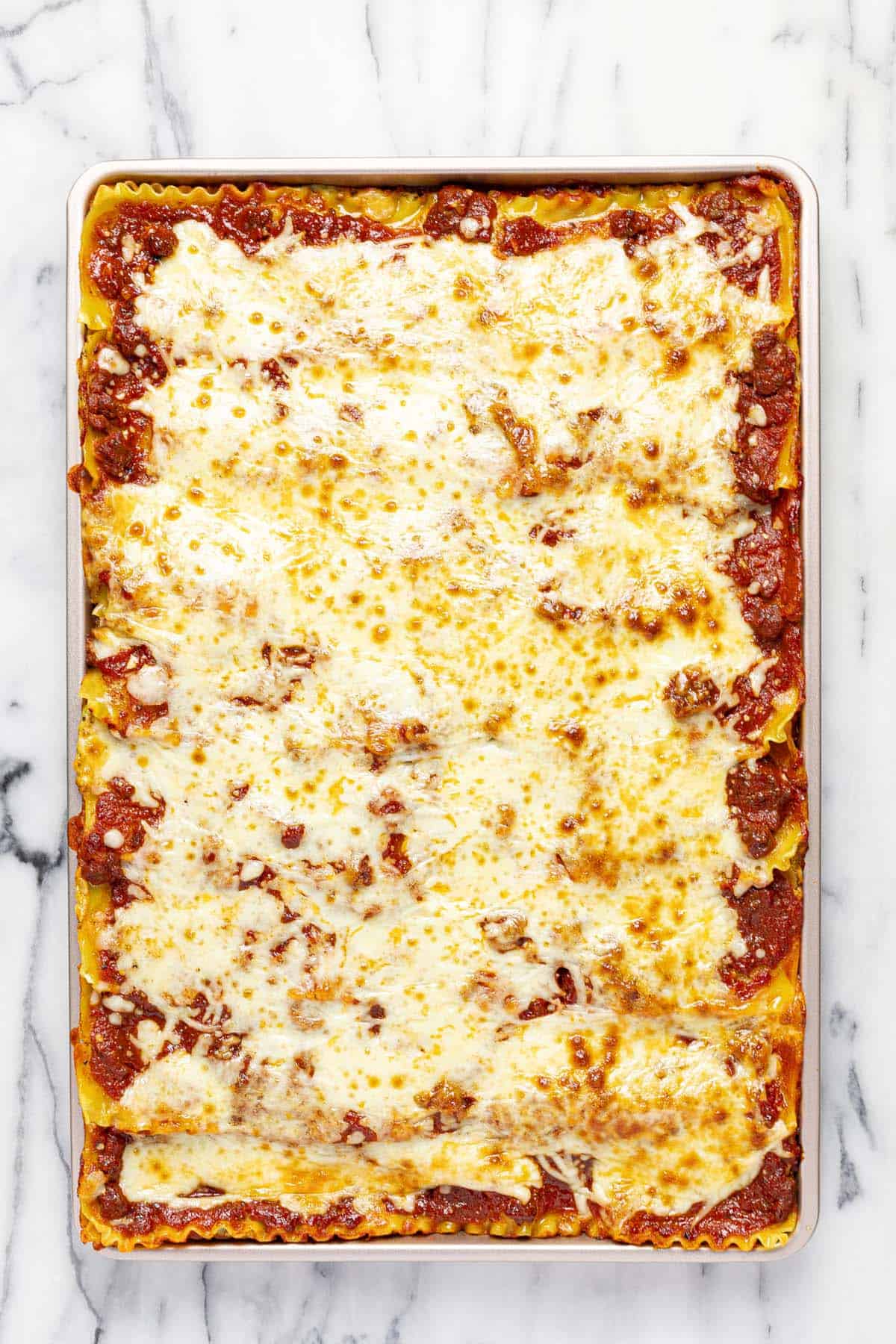 Freshly baked homemade sheet pan lasagna.