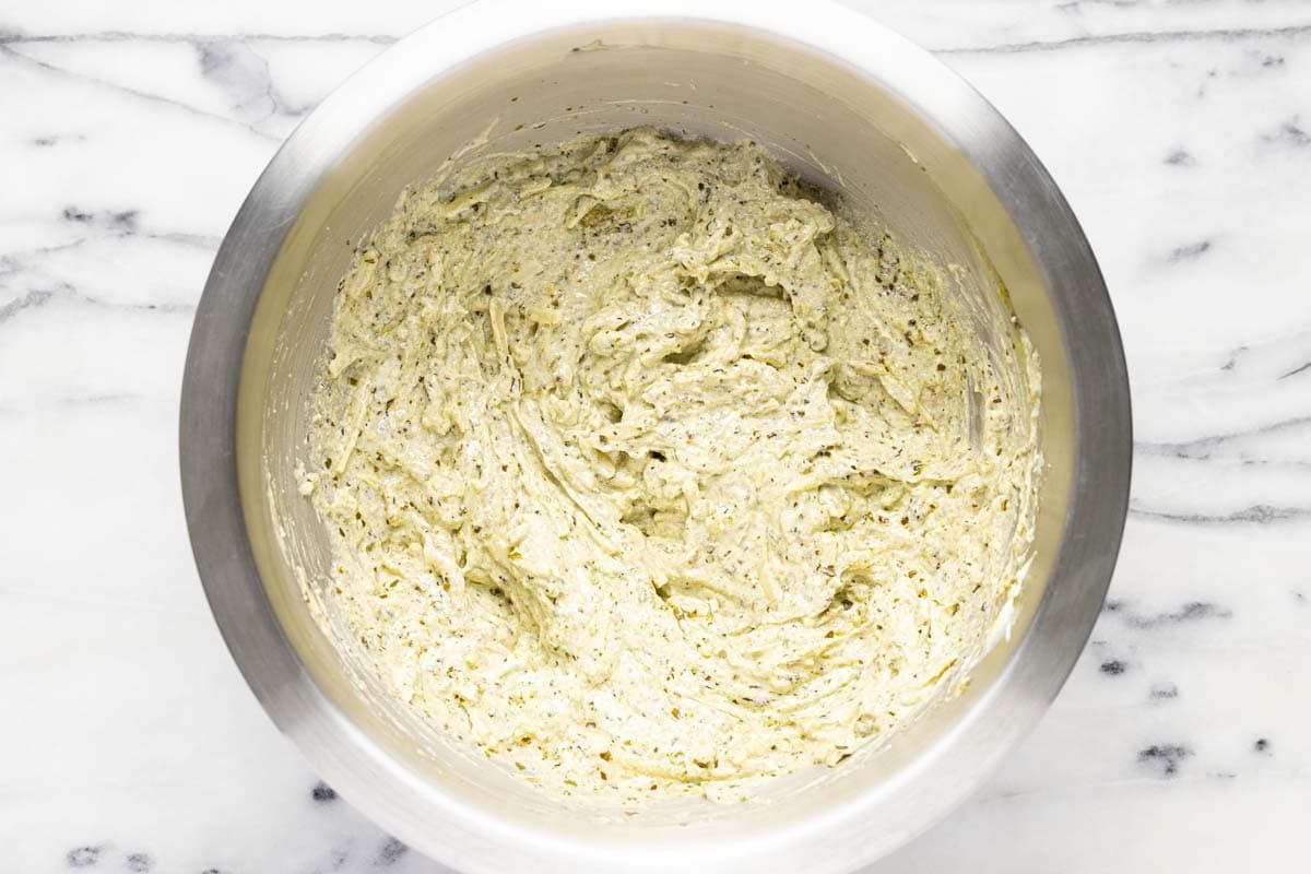 Bowl filled with creamy lasgana cheese filling. 