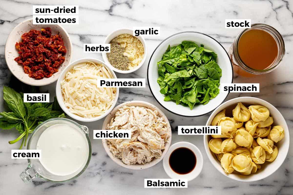 Bowls of ingredients to make Tuscan chicken tortellini. 