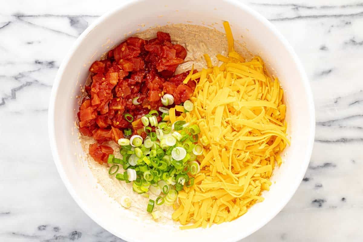 Large bowl filled with ingredients to make boat dip. 