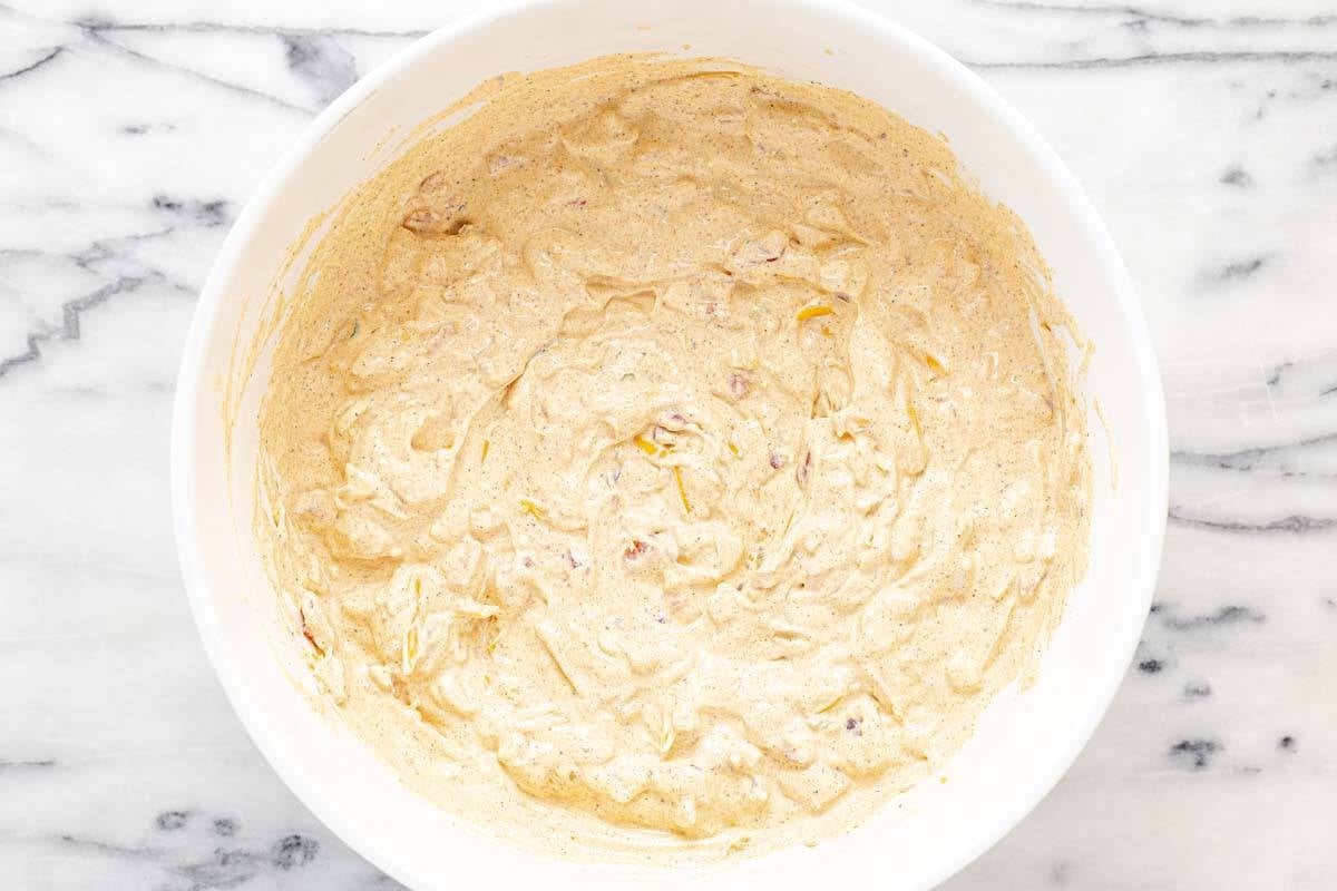 Large bowl filled with creamy homemade boat dip. 