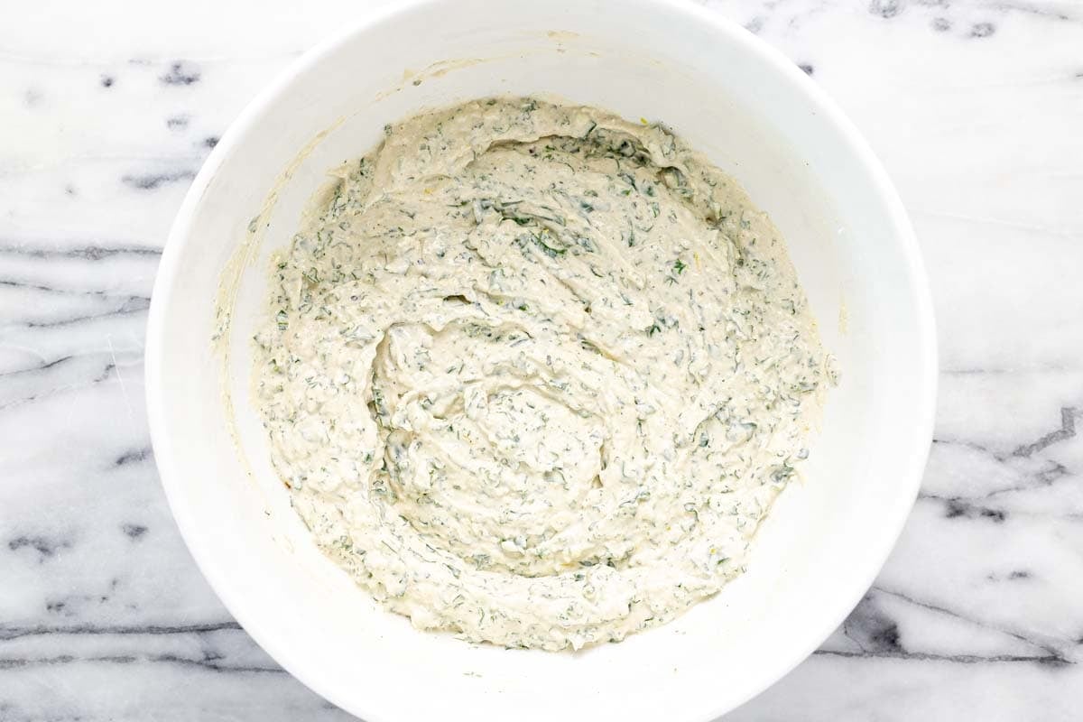 Creamy homemade Caesar salad dip in a large bowl. 