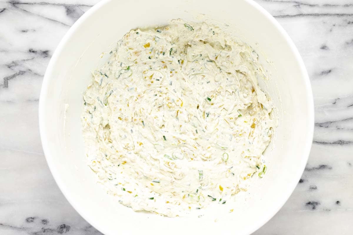 Freshly combined pepperoncini dip in a large bowl. 