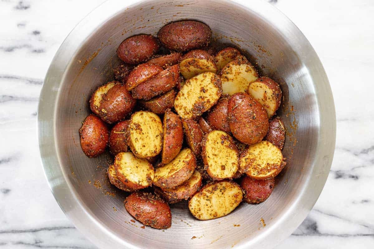 Bowl of seasoned red potatoes. 