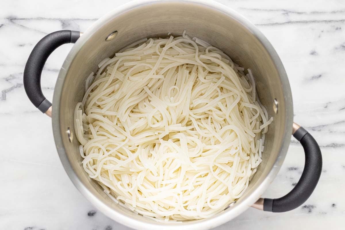 Cooked rice noodles in a large pot. 