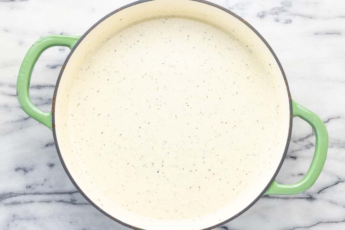 Pan filled with creamy au gratin cheese sauce. 