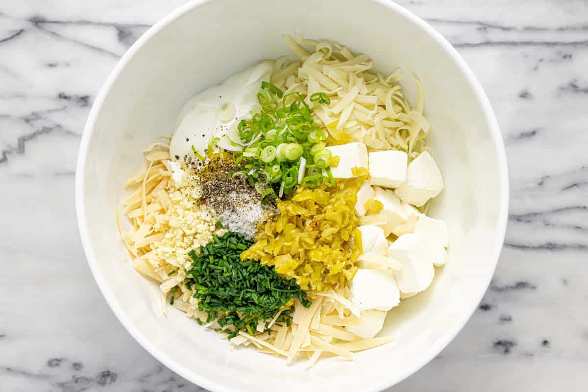 Bowl filled with ingredients to make pepperoncin dip.