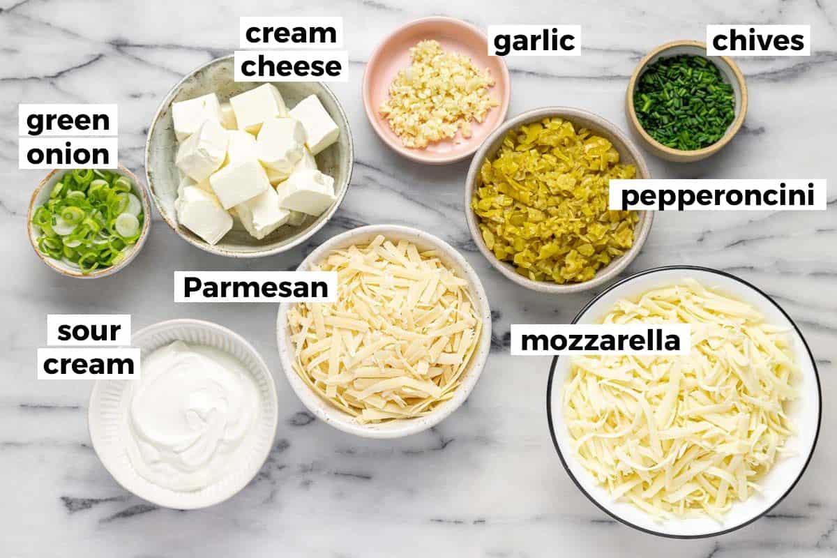 Bowls of ingredients to make baked peppperoncini dip.
