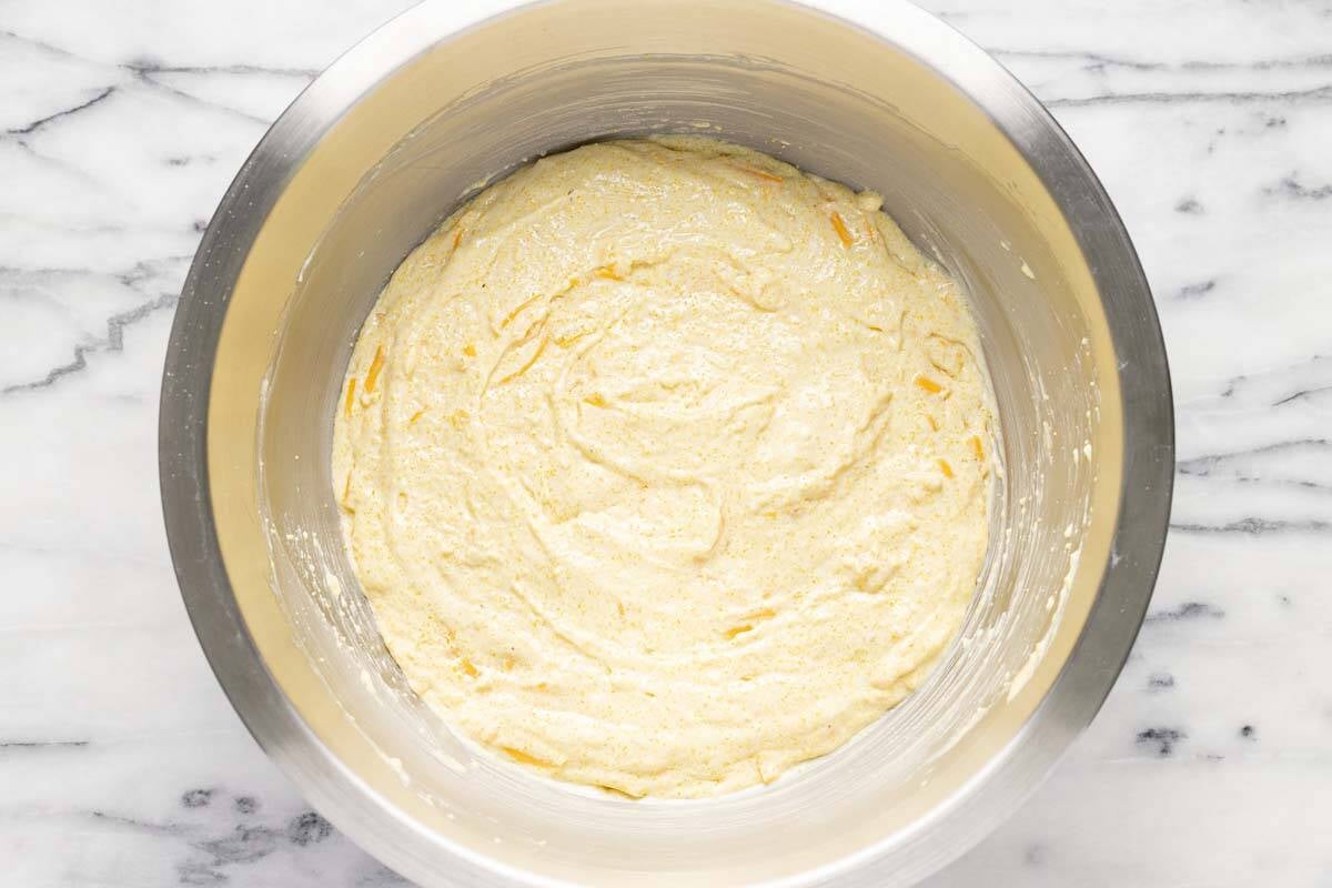 Cheesy cornbread mix in a large bowl. 