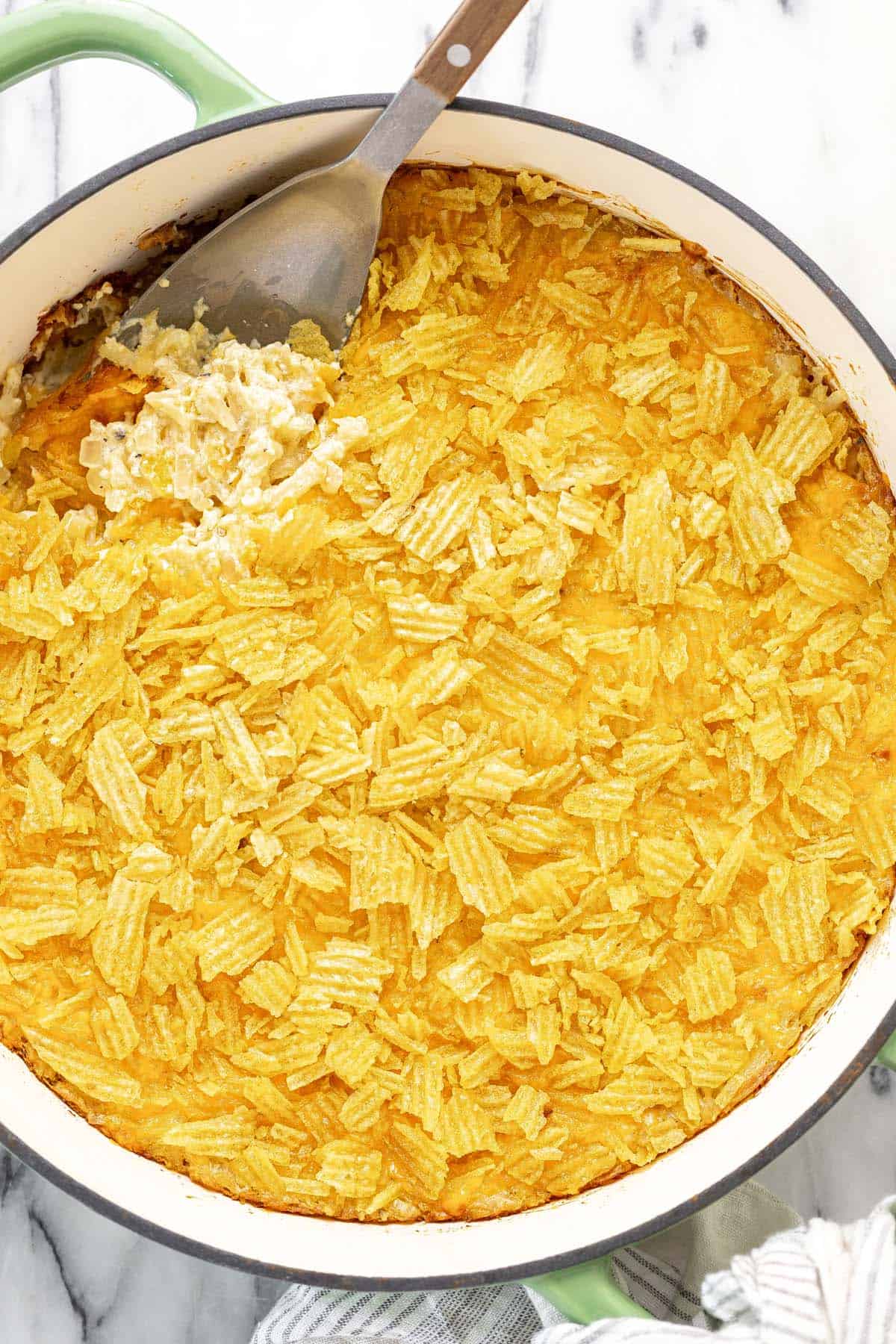 Freshly baked cheesy hashbrown casserole in a pan. 