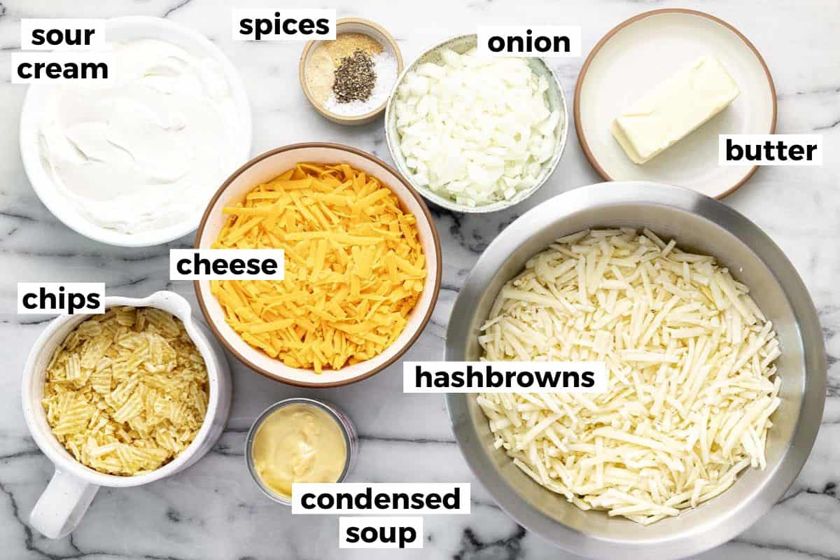 Bowls of ingredients to make cheesy hashbrown casserole. 
