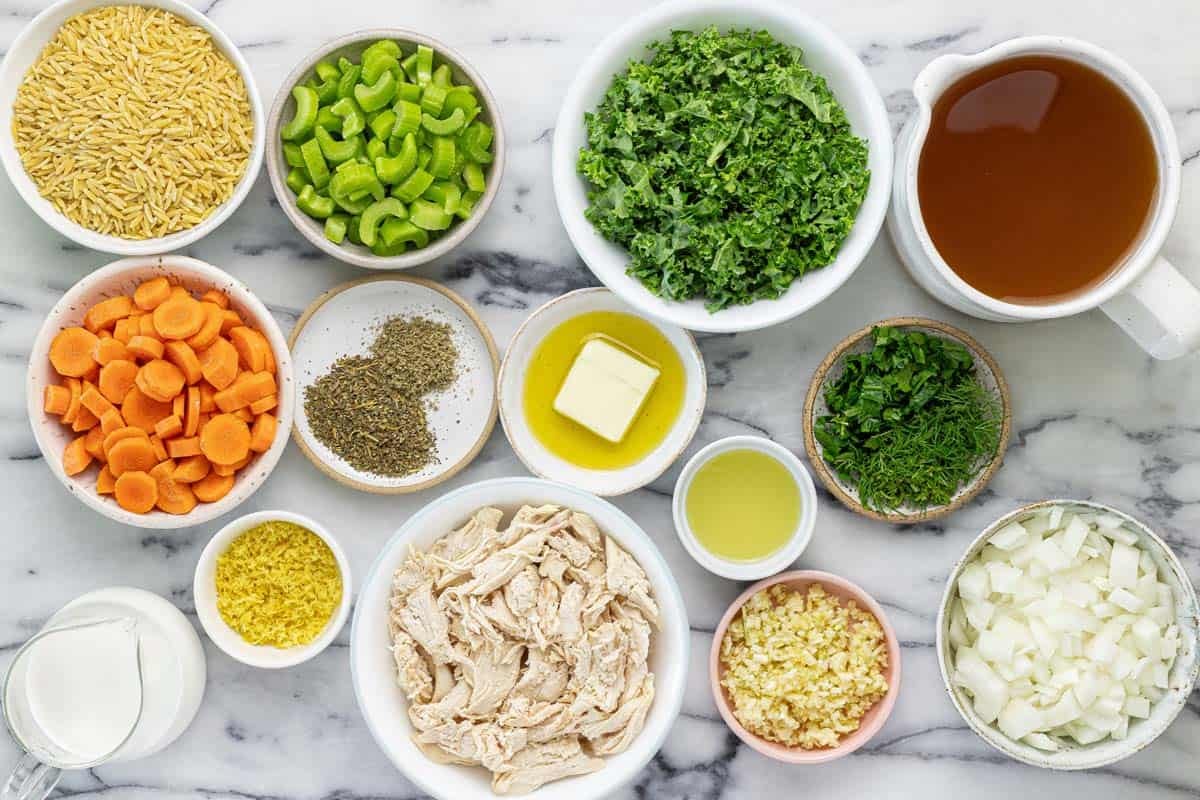Bowls of ingredients to make creamy lemon orzo chicken soup. 