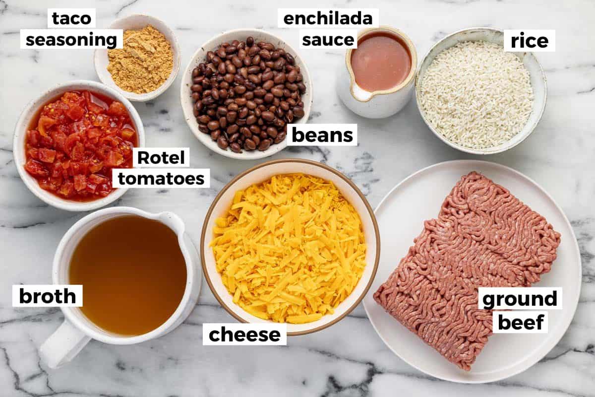 Bowls of ingredients to make cheesy taco rice.