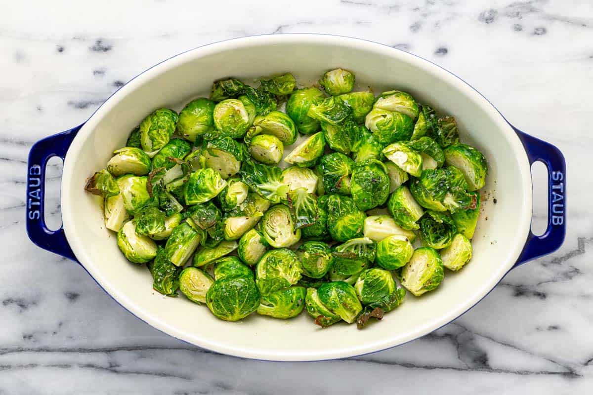 Baking dish filled with roasted Brussels sprouts. 