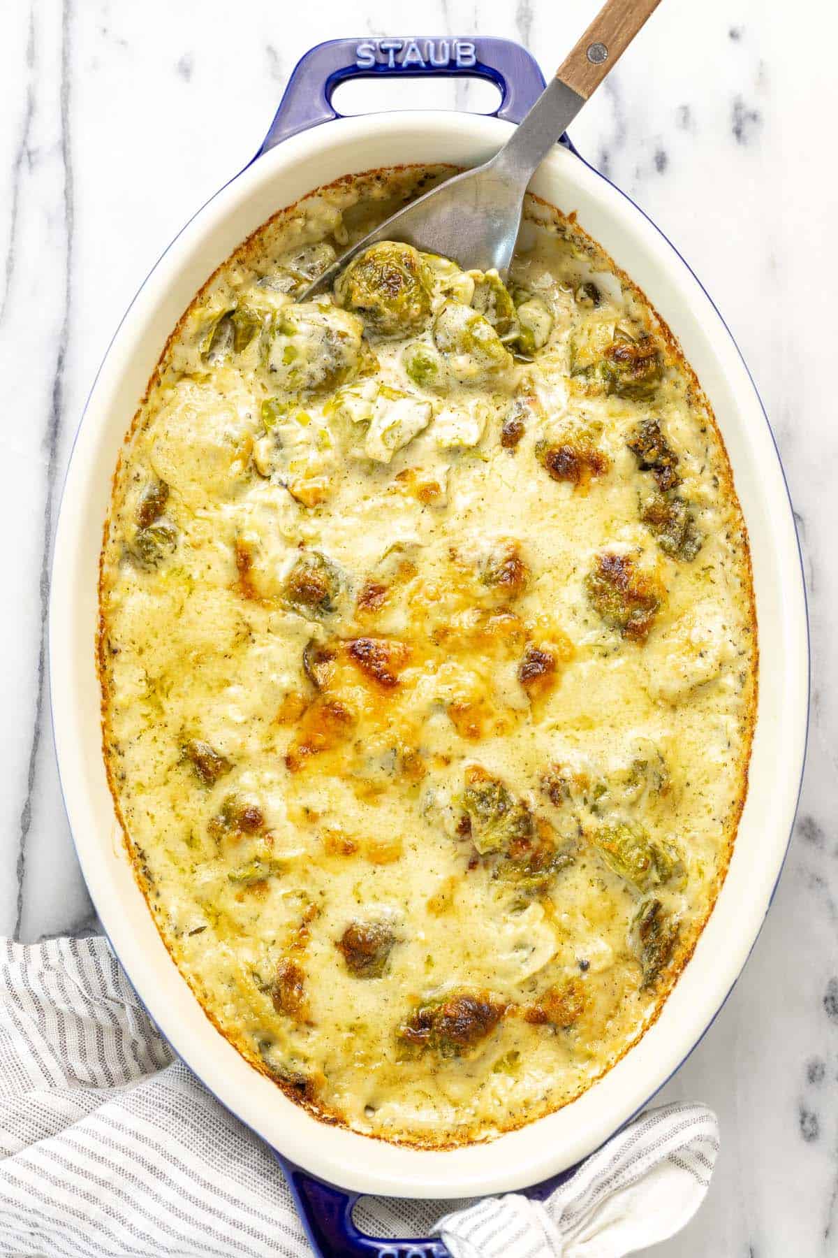 Baking dish filled with Brussels sprouts au gratin.
