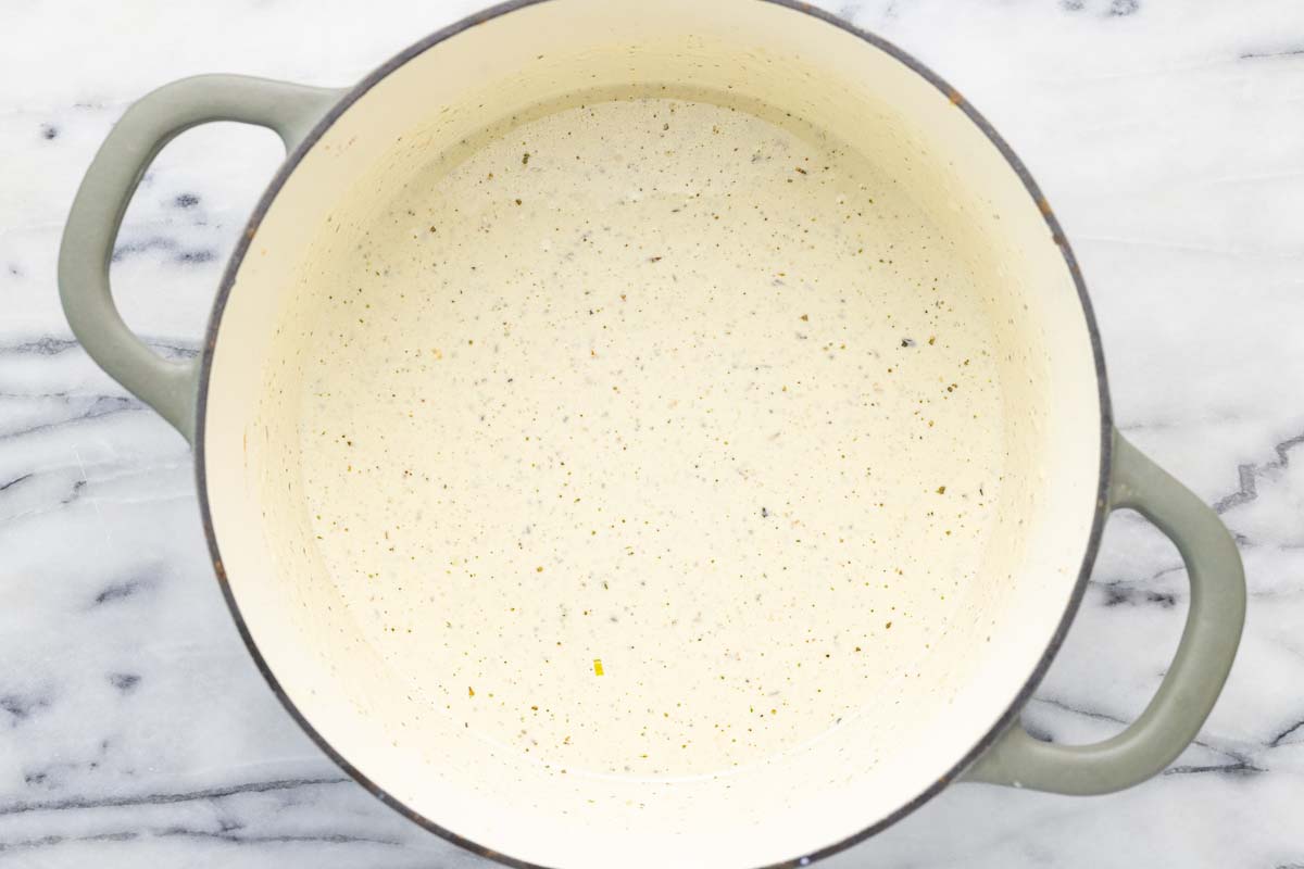 Creamy au gratin sauce in a large pot. 