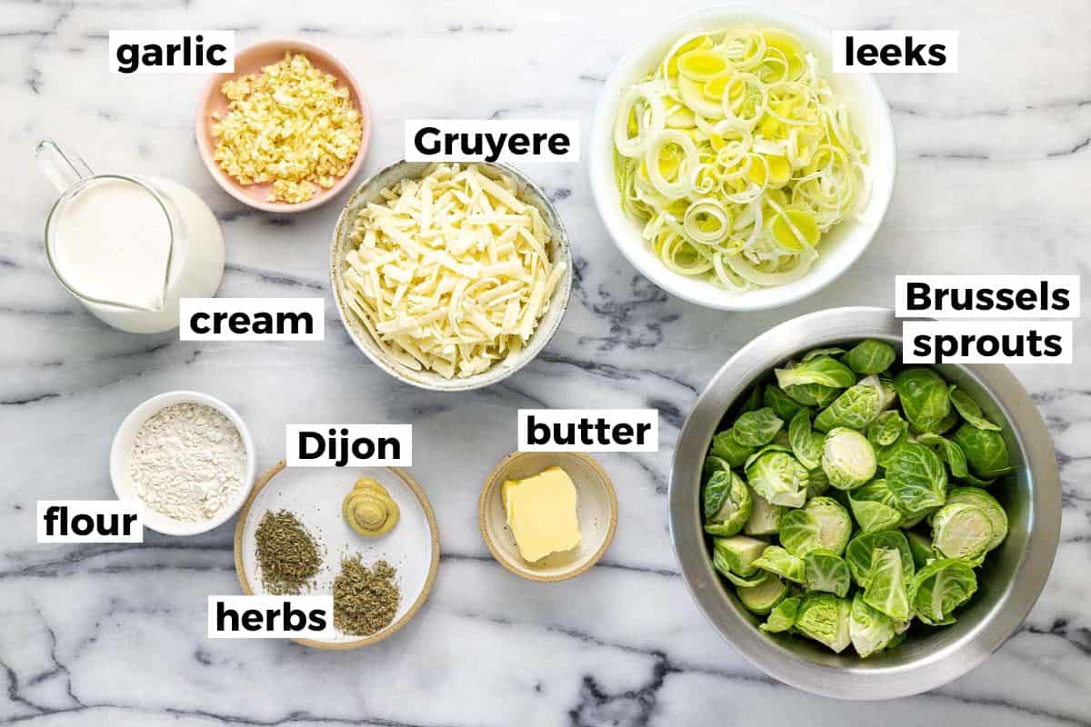 Bowls of ingredients to make Brussels sprouts au gratin. 