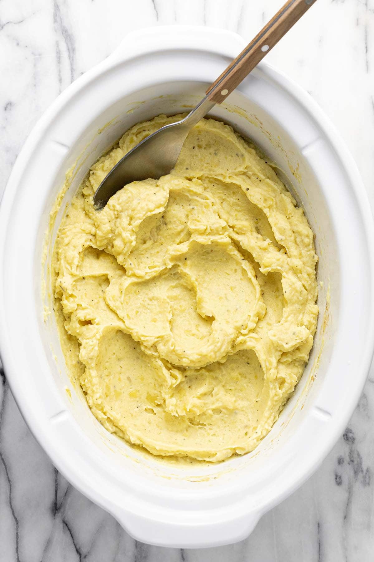Creamy mashed potatoes in a large crock pot. 