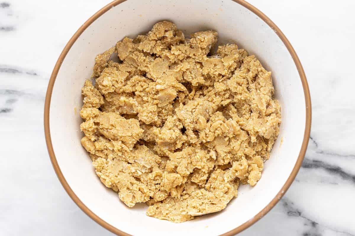 Bowl filled with crumble topping for the French toast bake.