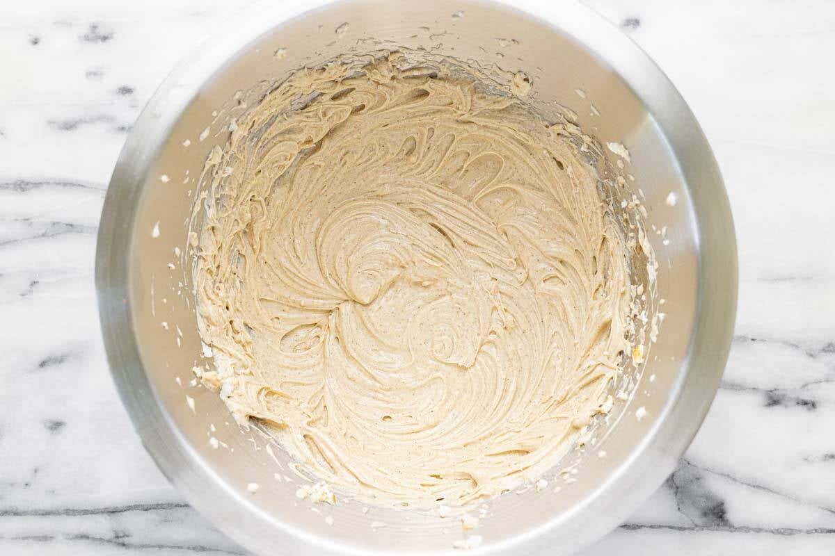 Creamy brown sugar and cinnamon cream cheese mixture in a bowl.