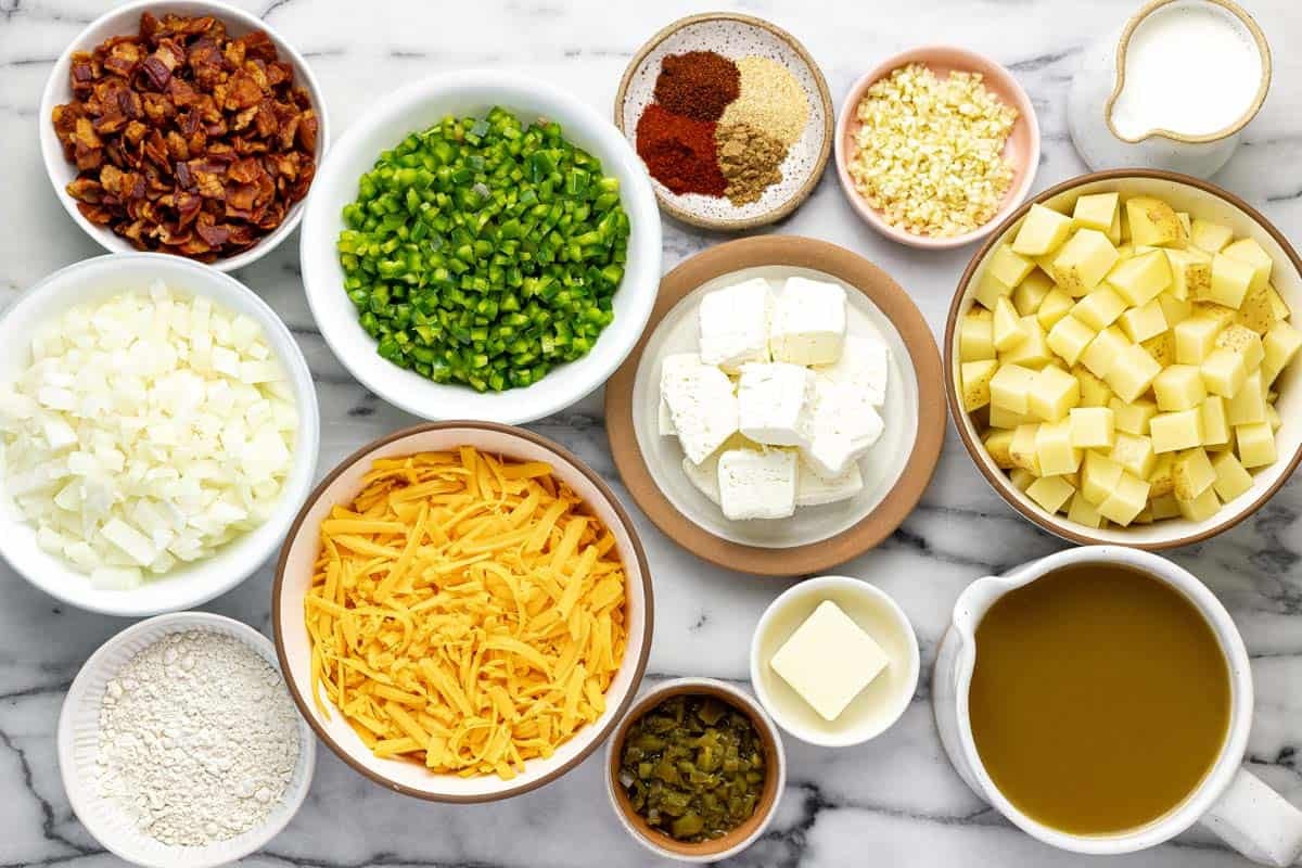 Bowls of ingredients to make jalapeno popper potato soup. 