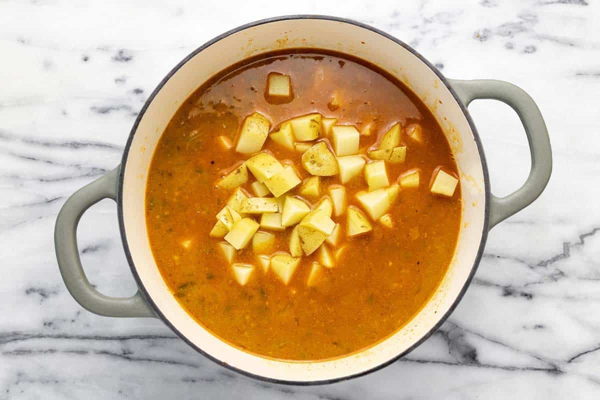 Ingredients to make jalapeno popper soup in a large pot. 