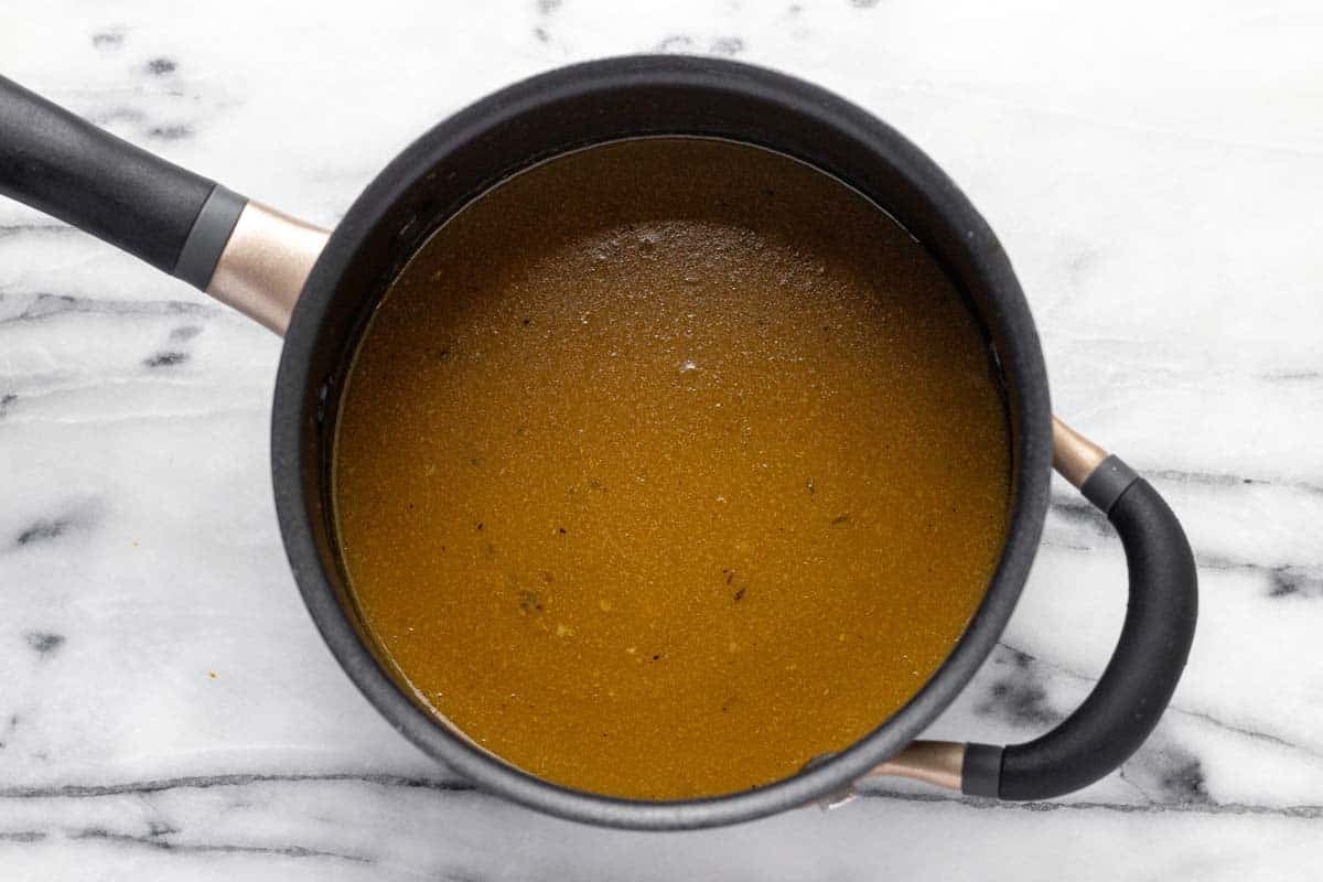 Brown gravy in a small saucepan. 