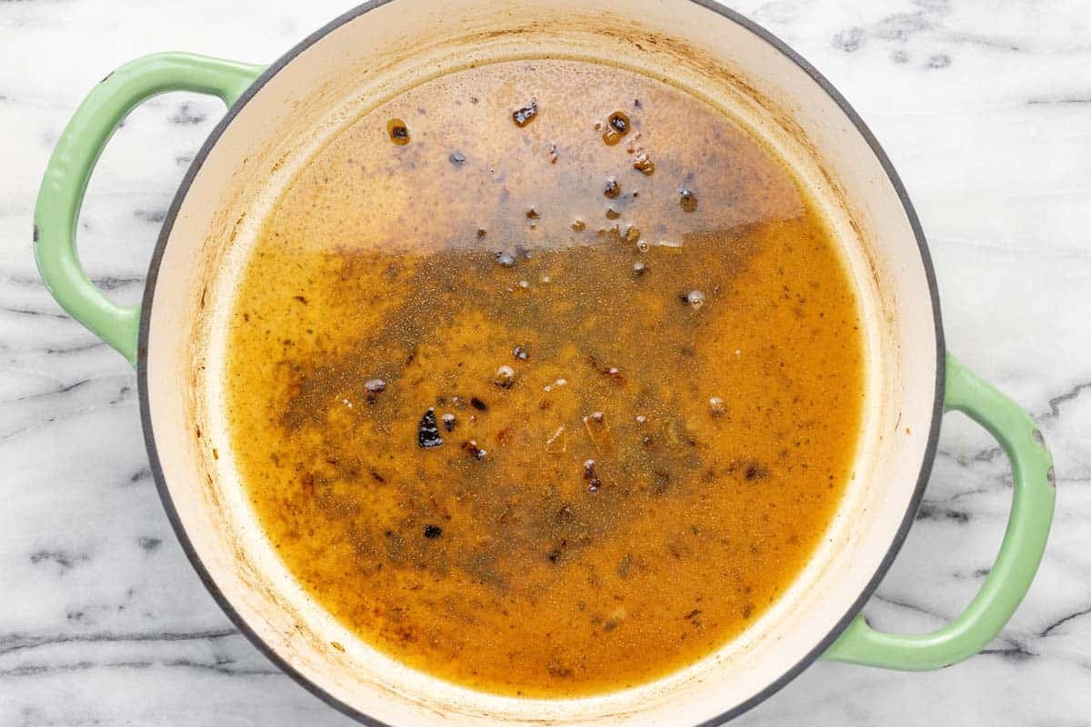 Wine cooking in a large pan to degalze and make the sauce.