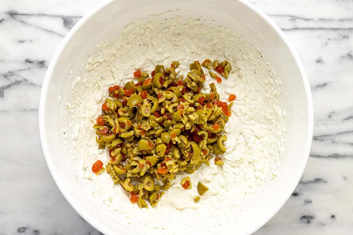 Chopped olives added to creamy olive dip. 