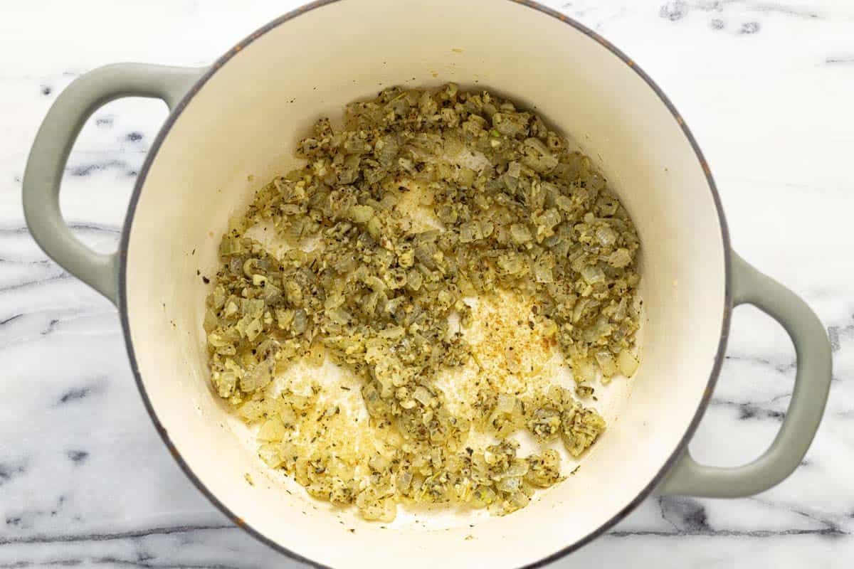 Sauteed veggies, garlic, herbs, and flour in a large pot.