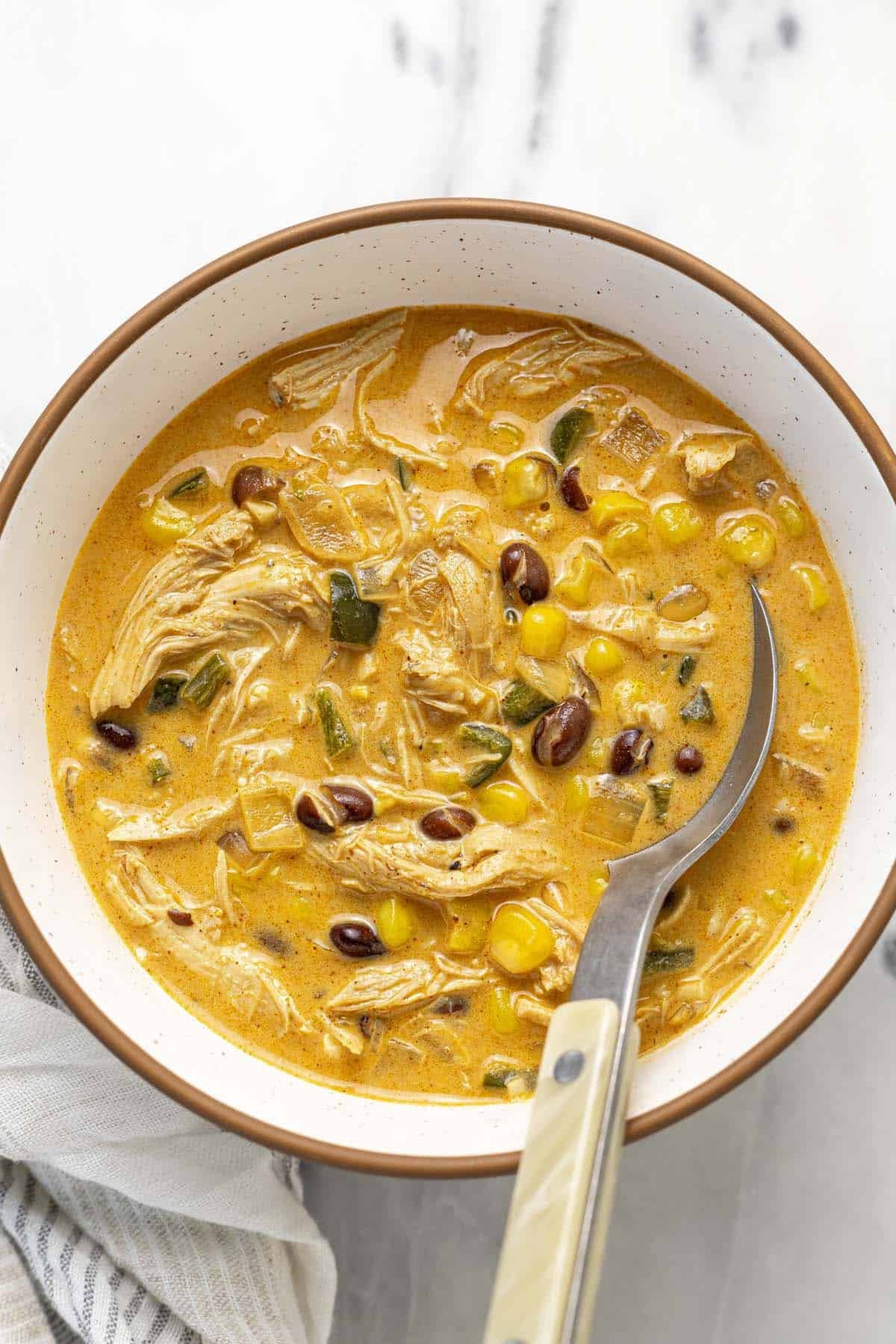 Large bowl of creamy poblano chicken soup.