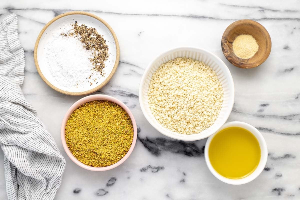 Bowls of ingredients to make crispy breadcrumb topping.