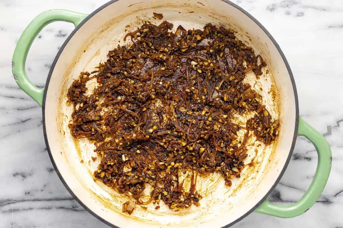 Caramelized onions and minced garlic in a large pan.