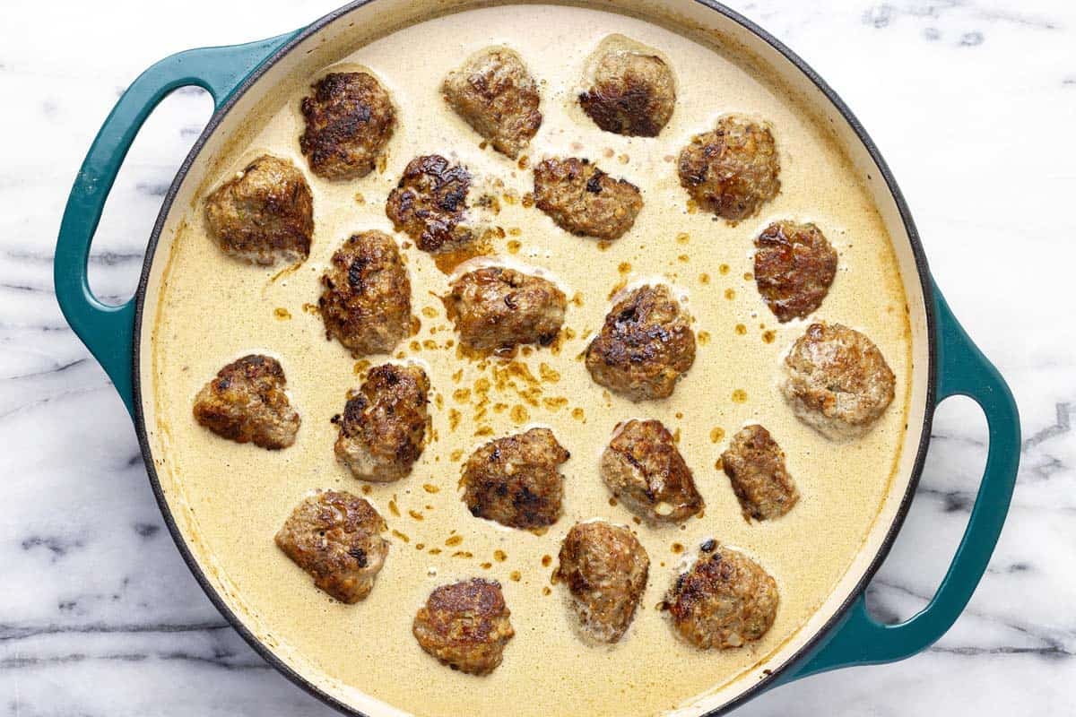 Creamy Swedish meatball sauce with freshly cooked meatballs.