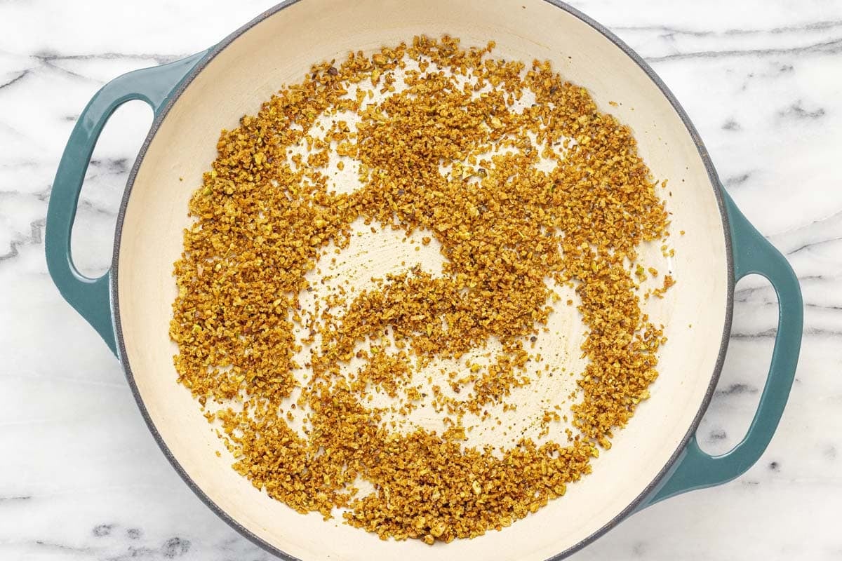 Crispy breadcrumb topping in a large pan.