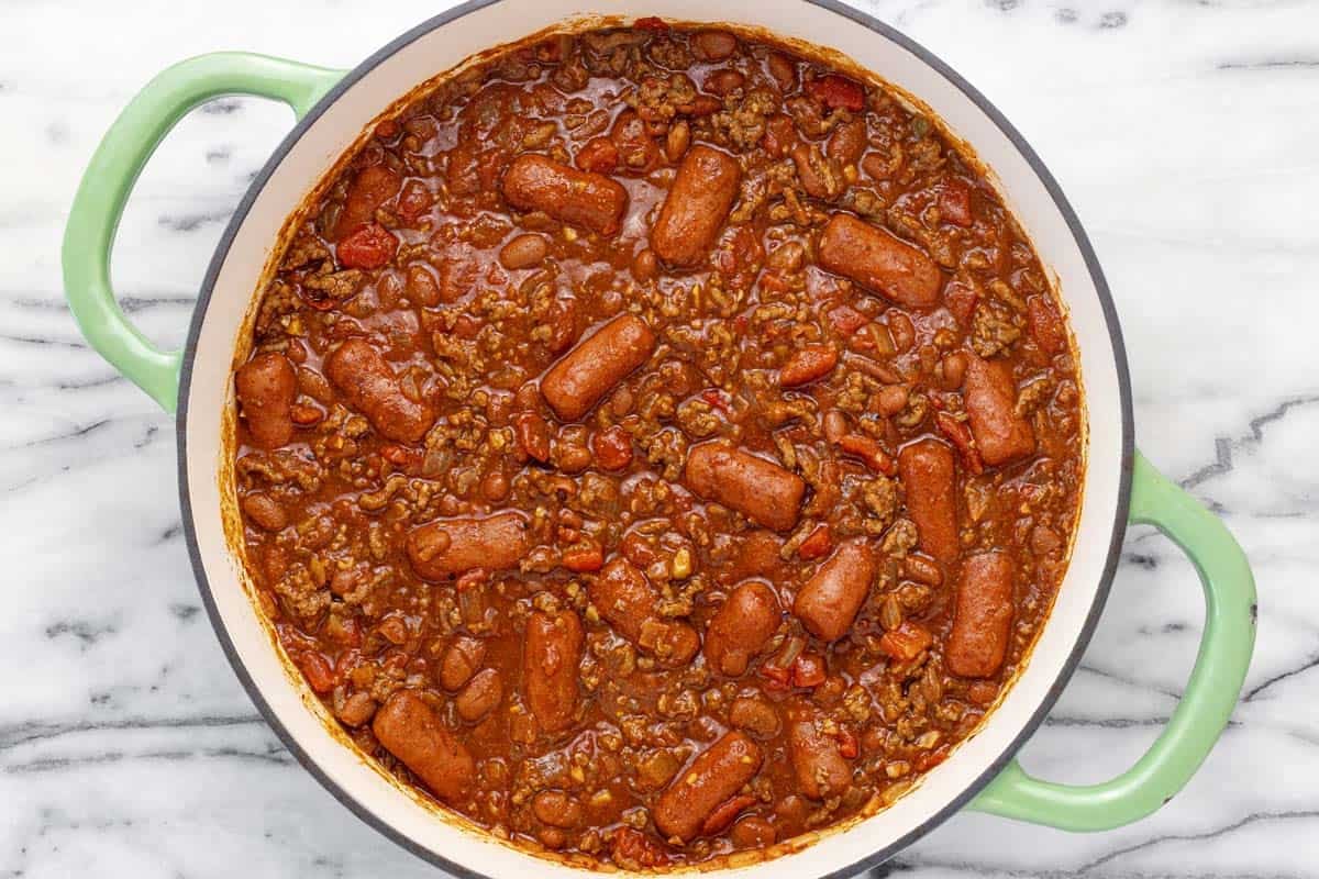 Large pan filled with chili dog chili.